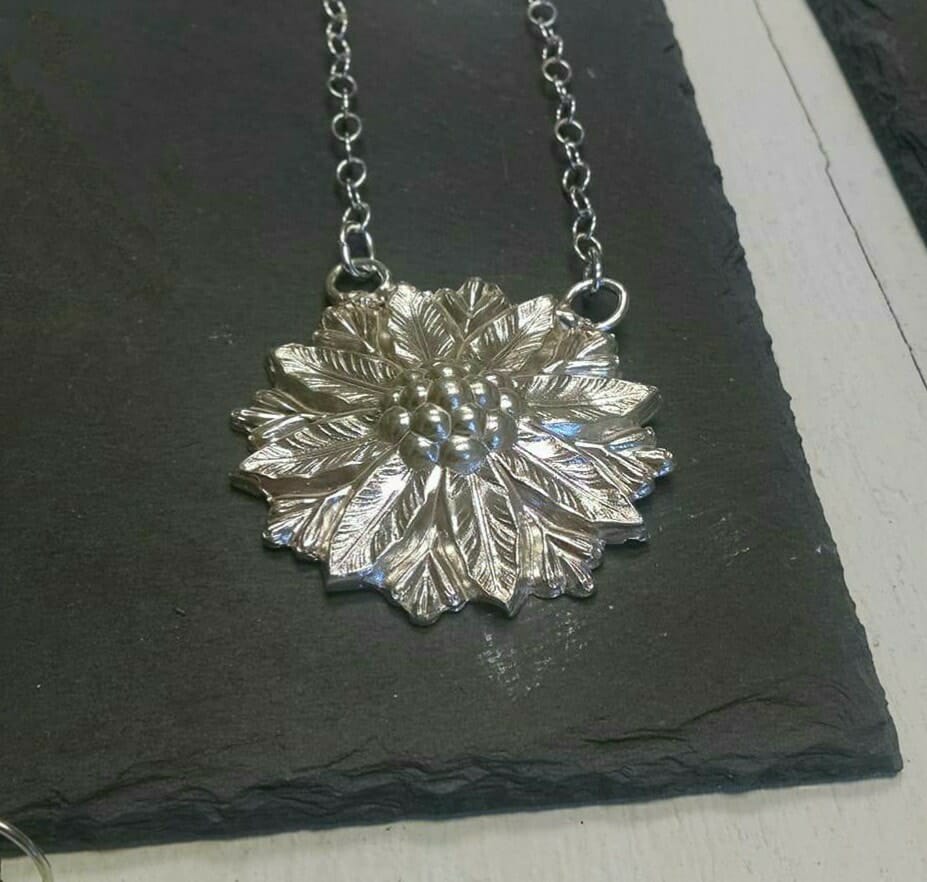 This beautiful piece was cast from a jewelry part made by an old RI manufacturer in the Victorian era. Jessica found the original piece at a flea market then cast it into silver!